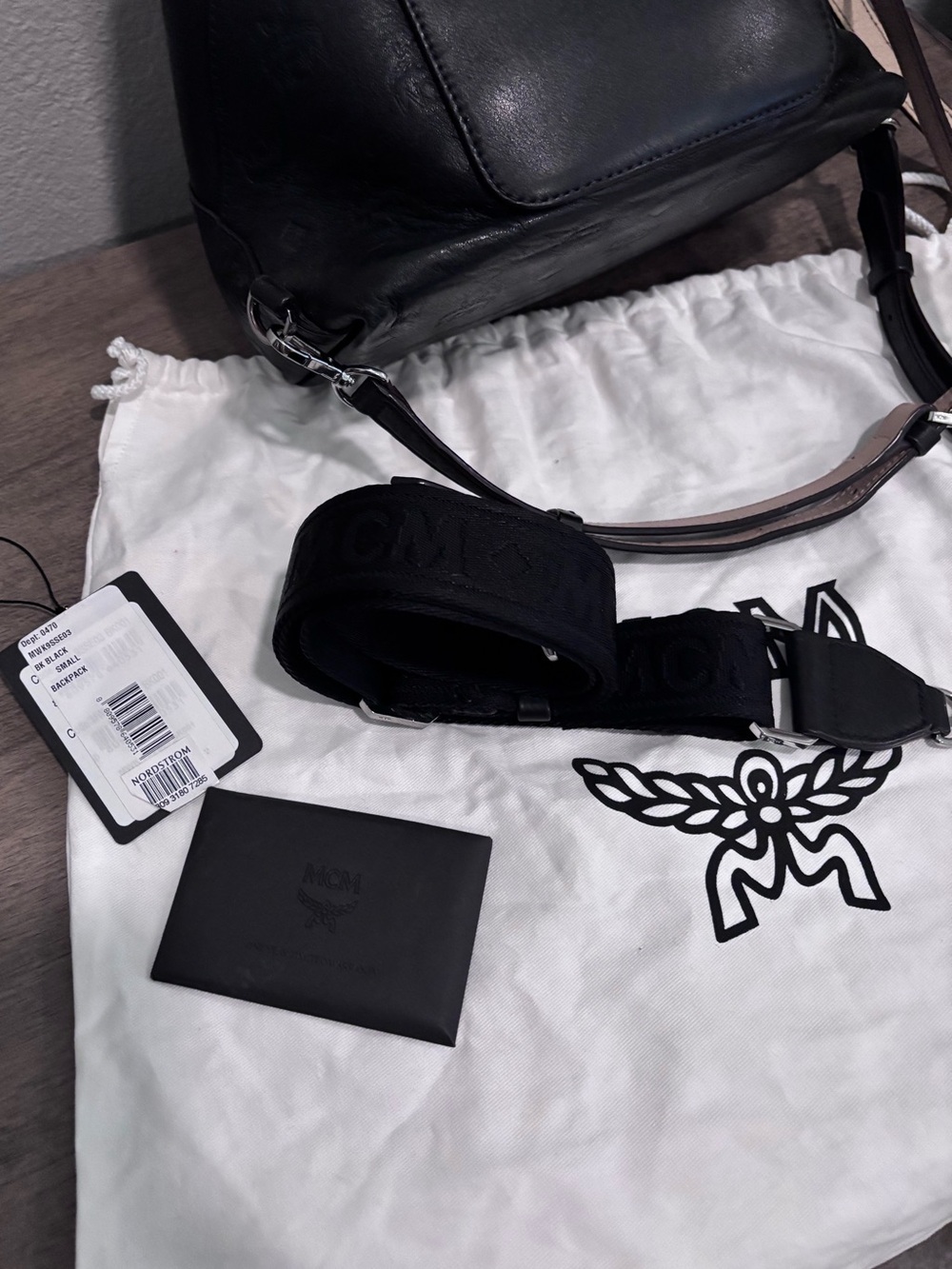 MCM Black Embossed Leather Drawstring Mini Backpack with Top Handle - Picture 9 of 9